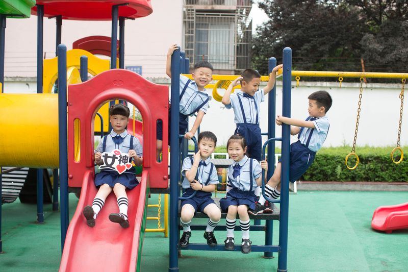 Children playing together on a colourful outdoor playground